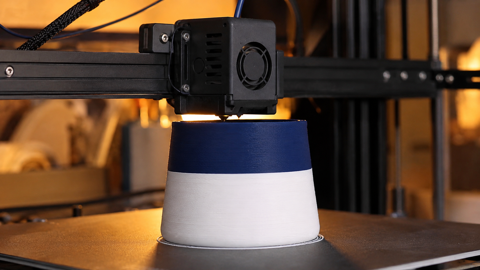A 3D print in progress showing a single clean color band transition layer on a standard FDM printer